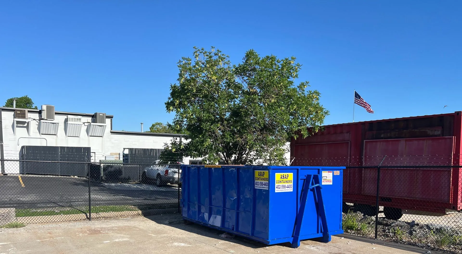 An ASAP Containers roll-off dumpster on a job site in Bellevue, NE